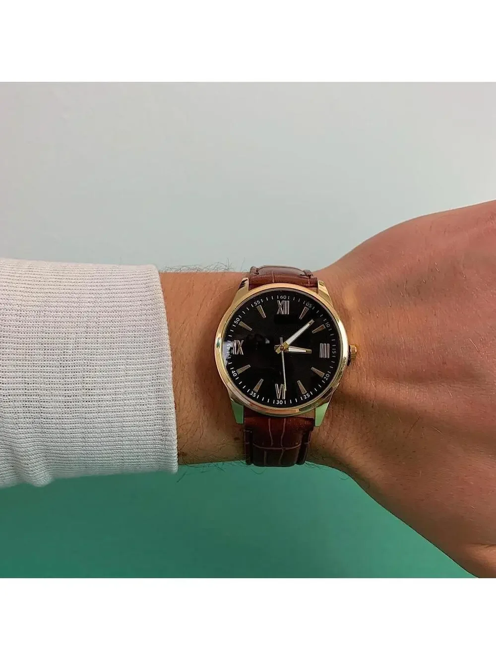 Minimalistic Black essential vintage style gold and leather style band watch. 9